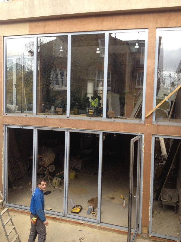 Aluminium bi-fold doors with two-storey glazing in Morden
