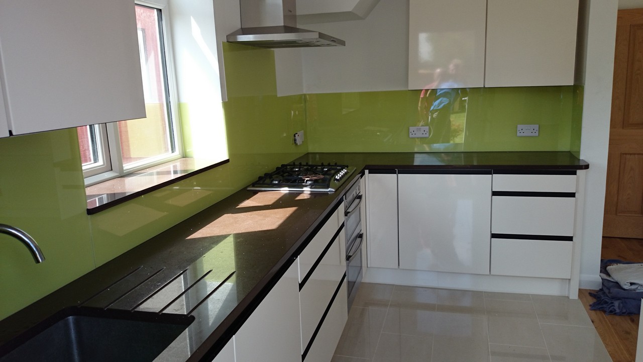 Lime green glass kitchen splashback installed by Morden glaziers