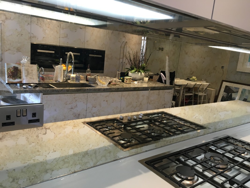 Mirror glass splashback in Morden luxury kitchen
